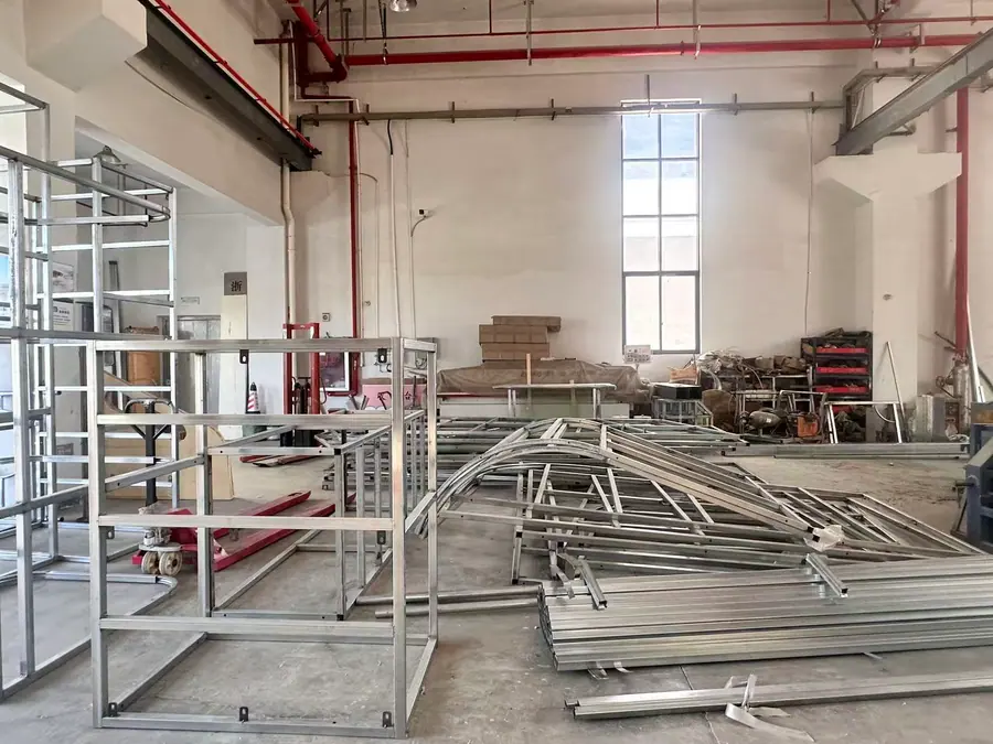 Steel playground frame fabrication inside HonPlay workshop