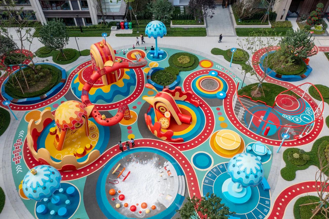 Multi-Functional Outdoor Playground Complex Galvanized Steel & HDPE top-down view of sandpit and blue mushroom seats for Dubai