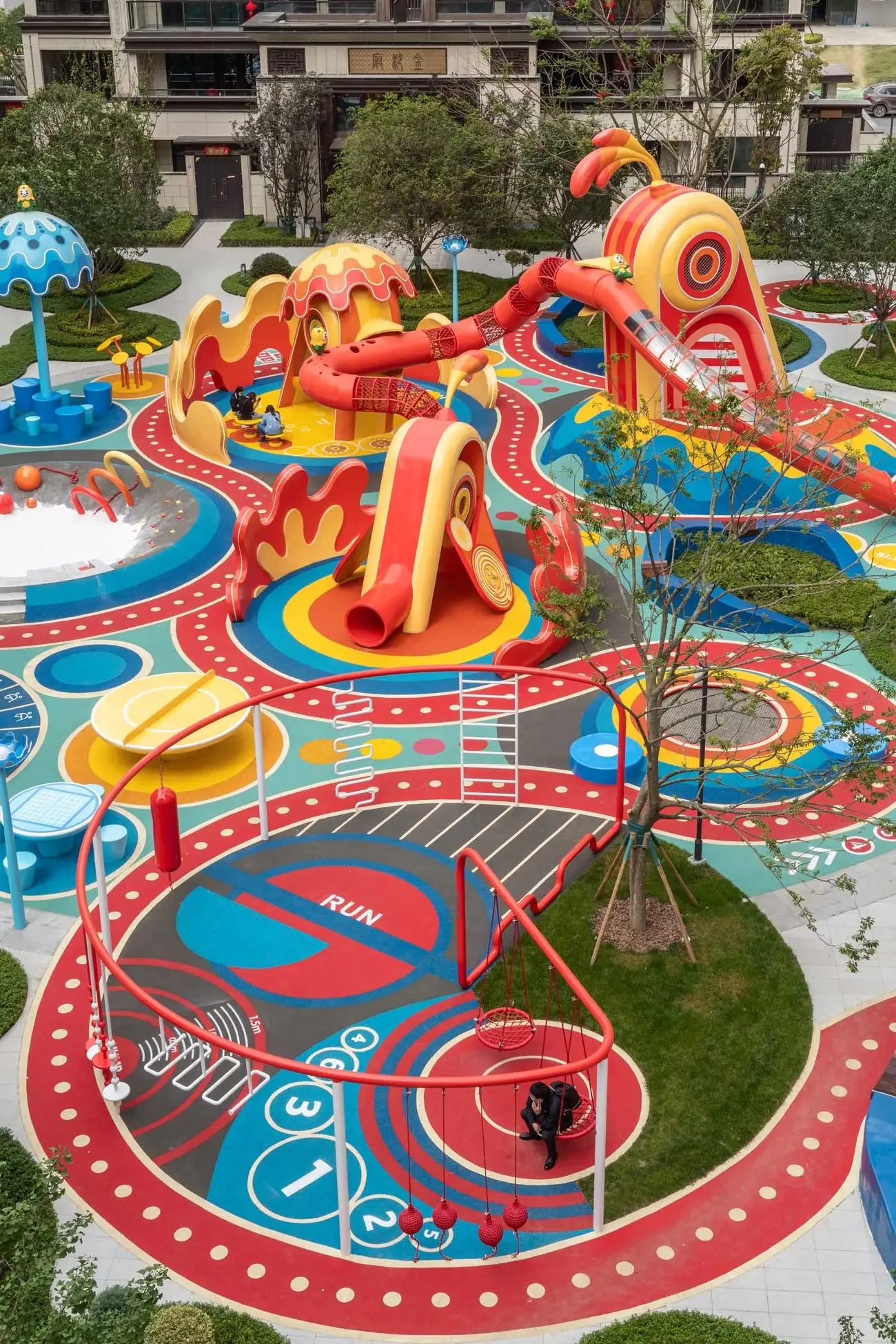 Multi-Functional Outdoor Playground Complex Galvanized Steel & HDPE circular swing set and colorful ground graphics for Dubai
