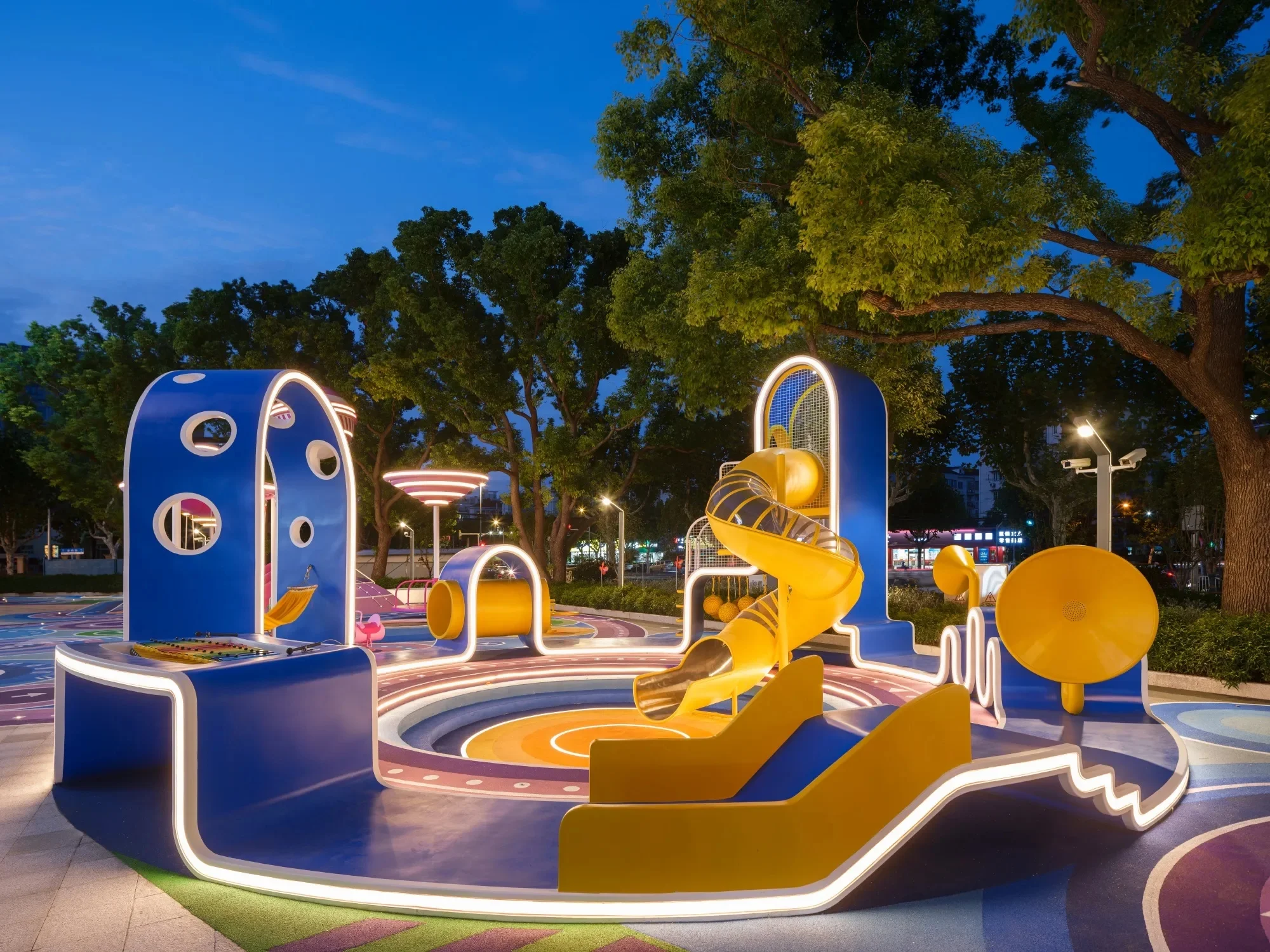 Vibrant Galaxy Theme Outdoor Playground Galvanized Steel & HDPE night view of illuminated blue arch and spiral slide for Berlin