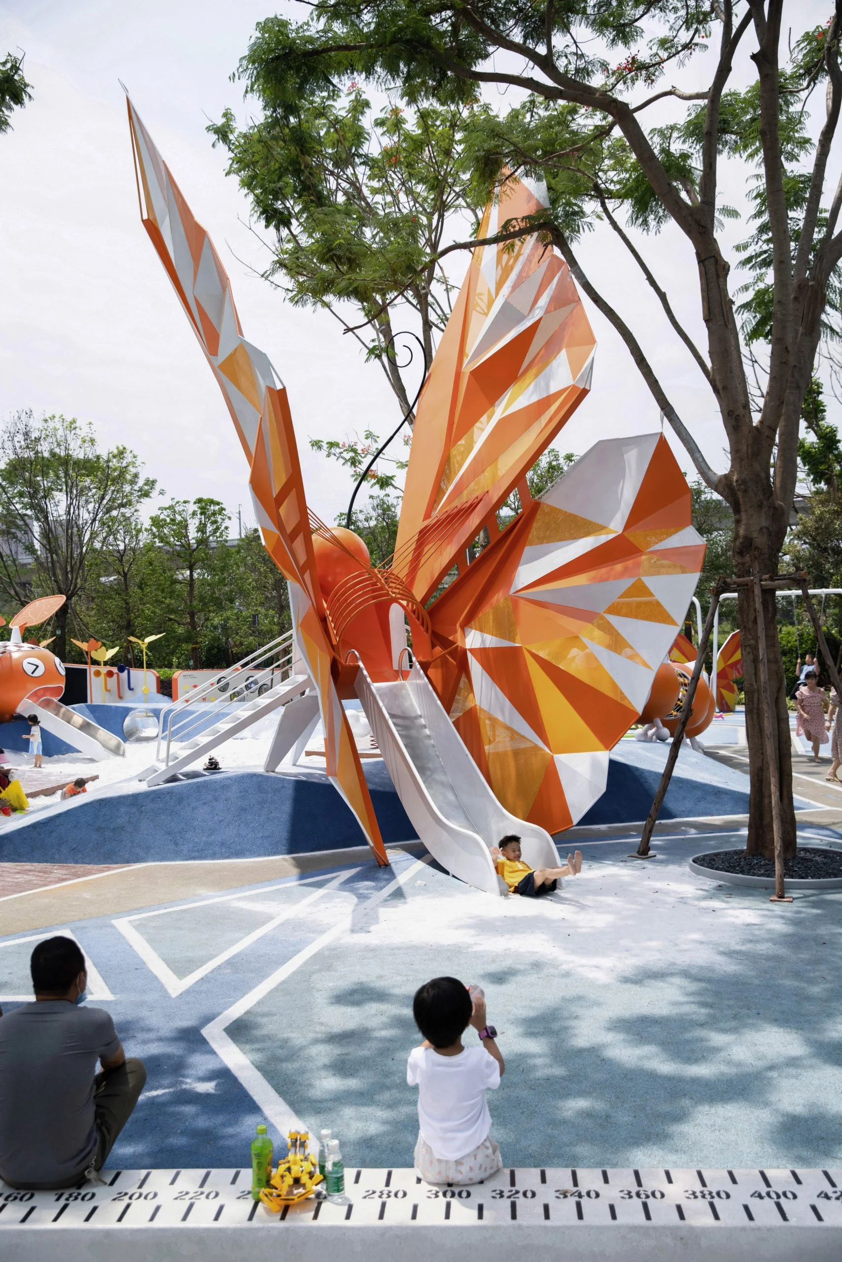Butterfly Theme Outdoor Playground in Galvanized Steel & HDPE showing large butterfly slide with child sliding for Singapore parks
