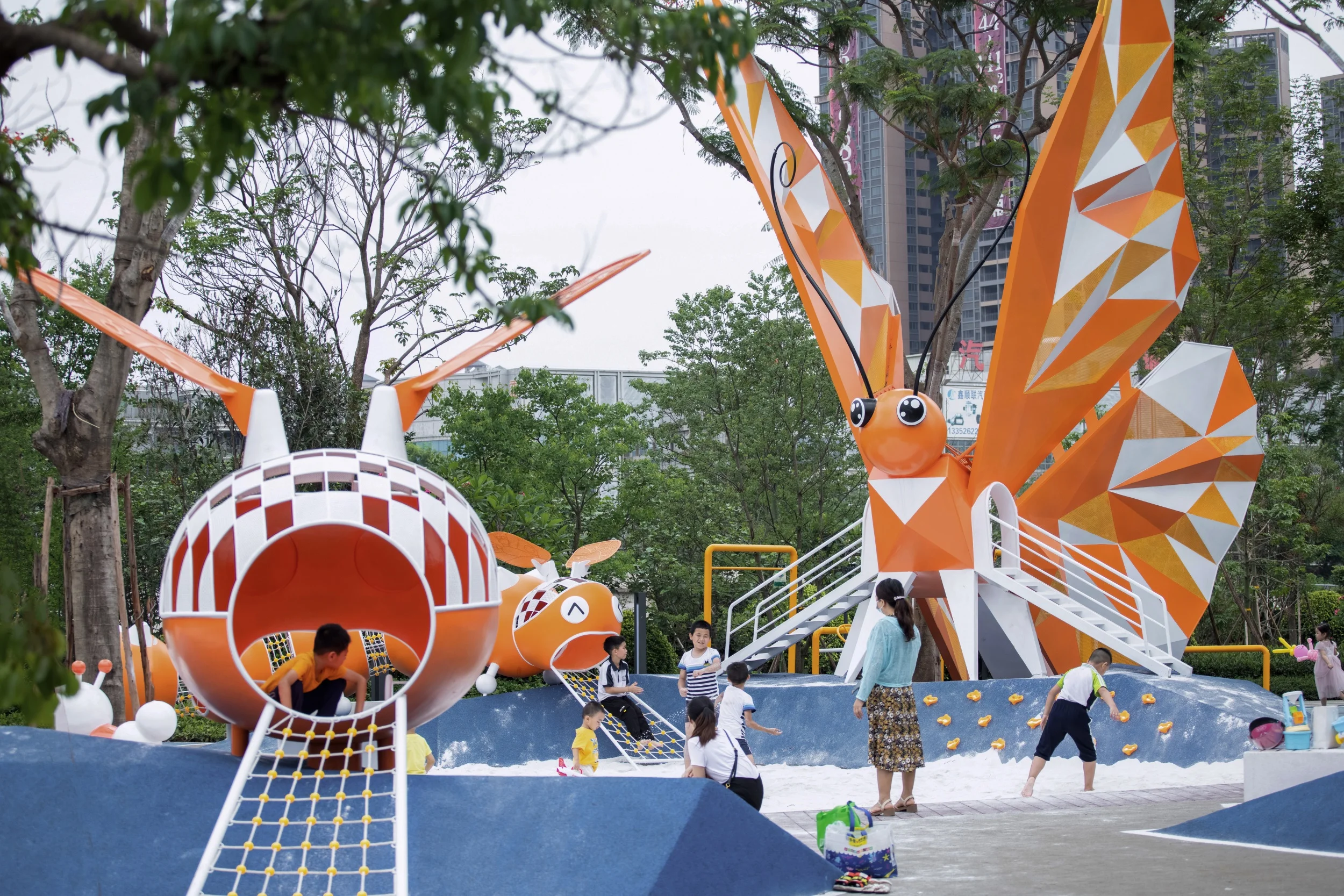 Butterfly Theme Outdoor Playground in Galvanized Steel & HDPE featuring orange insect pod with climbing net for Singapore urban parks