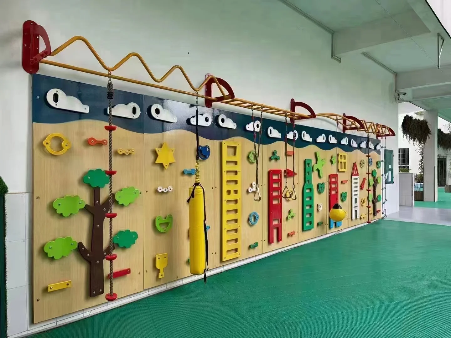 Interactive Wall Climbing & Sensory Play Panel in Galvanized Steel & HDPE with wall-mounted activity center for London primary schools