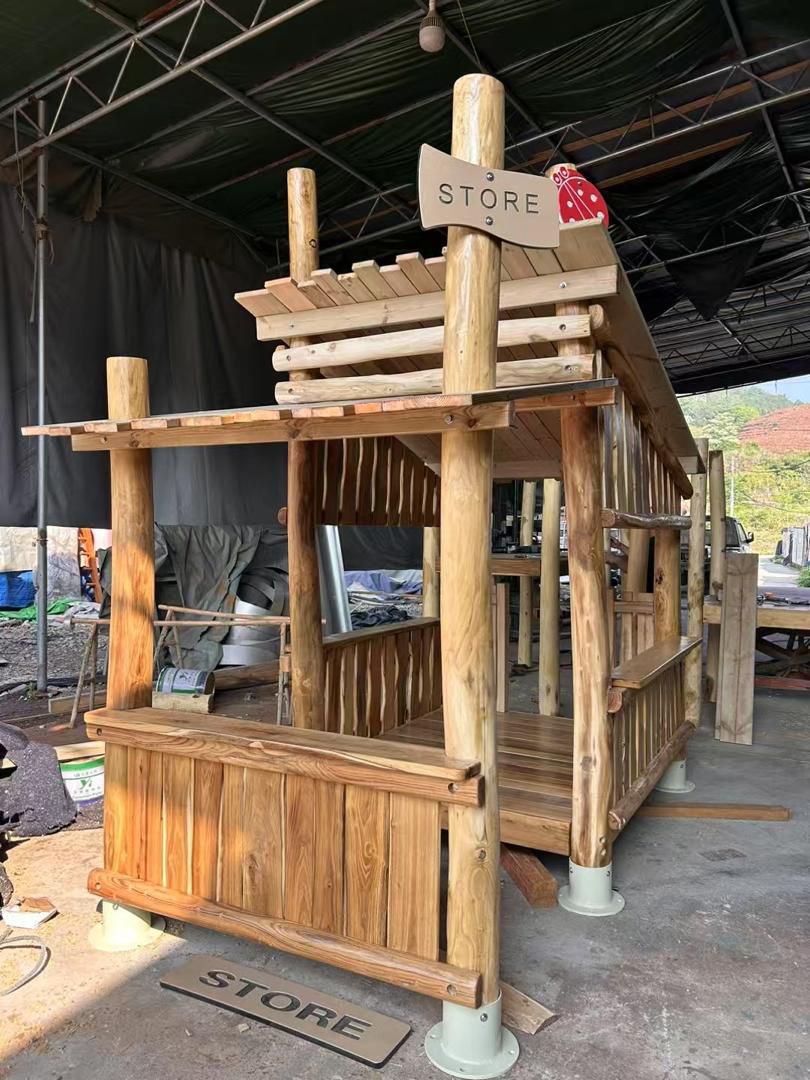 A Robinia hardwood play structure built by Hon Playground, showing the natural wood craftsmanship used for outdoor playgrounds.