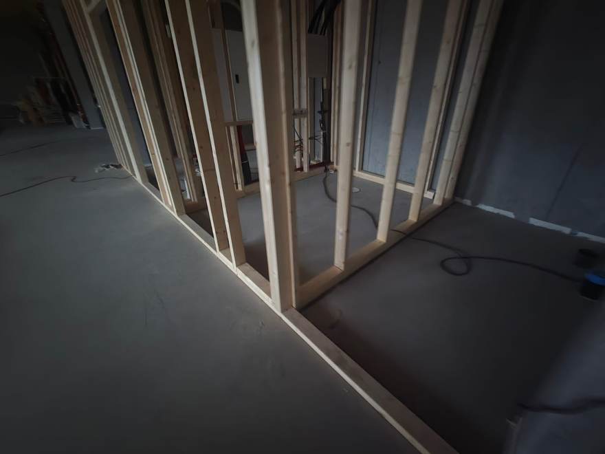 Construction progress at the TreToppen indoor playground site in Norway, with walls being built ahead of the custom playground installation