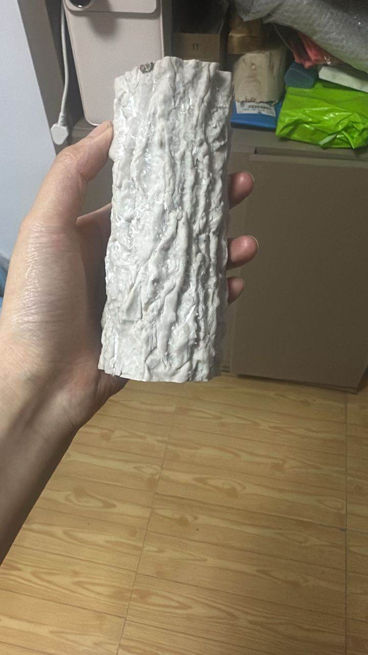 Deep-texture FRP fibreglass sample for a custom artificial tree in a themed indoor playground, showing matt bark texture instead of glossy plastic finish
